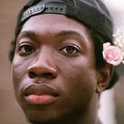 Cool black man with flower in hair